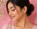Twisted Gold Oval Hoop Earrings